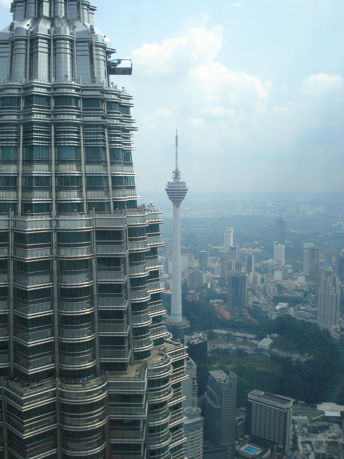 Closeup of one of the Petronas Twin Towers in Kuala Lumpur. These 88-floor towers - the tallest twin towers in the world - were completed in 1998. A two-story skybridge on the 41st and 42nd floors connects the towers and is the highest two-story bridge in the world. A double-decker elevator system is used in the towers - the bottom part for odd floors, the top part for even floors.  