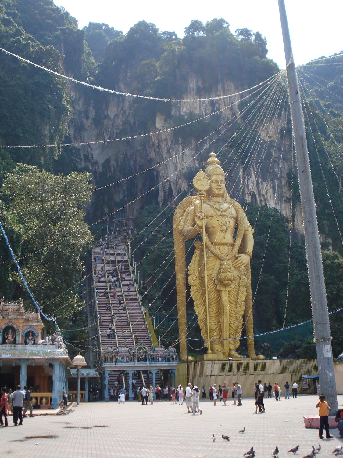 The Batu Caves, fronted by a statue of Lord Murugan, are a series of caves and cave temples built into a limestone hill located in the Gombak district north of Kuala Lumpur. Originally the caves were a shelter for indigenous folk; later the Japanese dug guano out of the caves. In 1891, they were turned into a Hindu shrine. The best known temple is Cathedral Cave; there is also an Art Gallery Cave, a Museum Cave, and a Ramayana Cave (devoted to the life of Rama). 