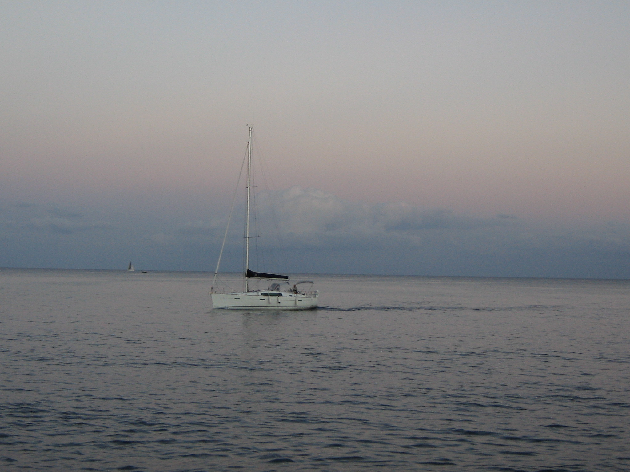 Boat cruising in to Saint Julian's (San Giljan) harbor.