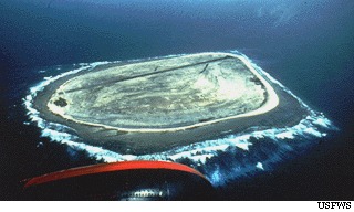 Aerial view of Baker Island. The World-War II-era runway along the northern part of the island is abandoned and unserviceable. Photo courtesy of the US Fish and Wildlife Service.