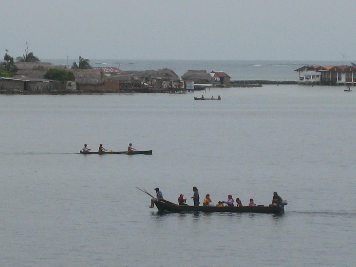 Kuna Indians rowing past their villages in the San Blas Islands of northeastern Panama. 