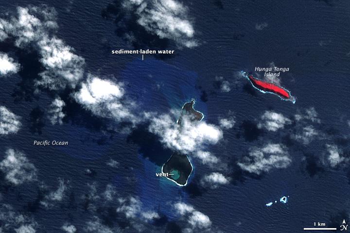 In mid-March 2009, a plume of ash and gas burst out of the ocean as an undersea volcano began to erupt in the South Pacific nation of Tonga. Small sections of the rim of the large volcano had been above water, forming the islands of Hunga Tonga and Hunga Ha'apai (center). The eruption occurred at two vents, one submerged and the other on Hunga Ha'apai. The eruption pumped out enough rock and ash that by 25 March, when NASA's Terra satellite captured this image, the submerged vent was surrounded by new land.

The new land is the dark mass south of Hunga Ha'apai. It was not present in an earlier image taken on 14 November 2006 (next photo). In this image, clouds cover the space between the new land and Hunga Ha'apai, but the new land connects Hunga Ha'apai with the underwater vent, essentially enlarging the small island. The vent itself is the nearly perfectly circular hole near the southern edge of the new land.

Also revealed are some of the other impacts of the eruption. The ocean around the erupting volcano is bright blue, likely colored with ash, rock, and other volcanic debris. The eruption killed or damaged plants on Hunga Ha'apai. In this false-color image, plant cover is red. In 2006, Hunga Ha'apai had supported vegetation, but after the eruption, the island was black. Either the plants were buried in ash or dead in the wake of the eruption. Photo courtesy of NASA.

