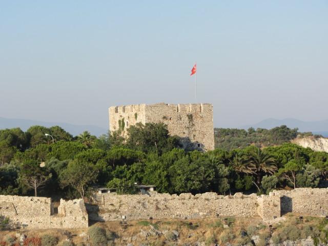 View of the restored castle on Pigeon Island (Guvercin Adasi) in the harbor of Kusadasi. The fortress was the center of the town's activities in the late 19th century. 