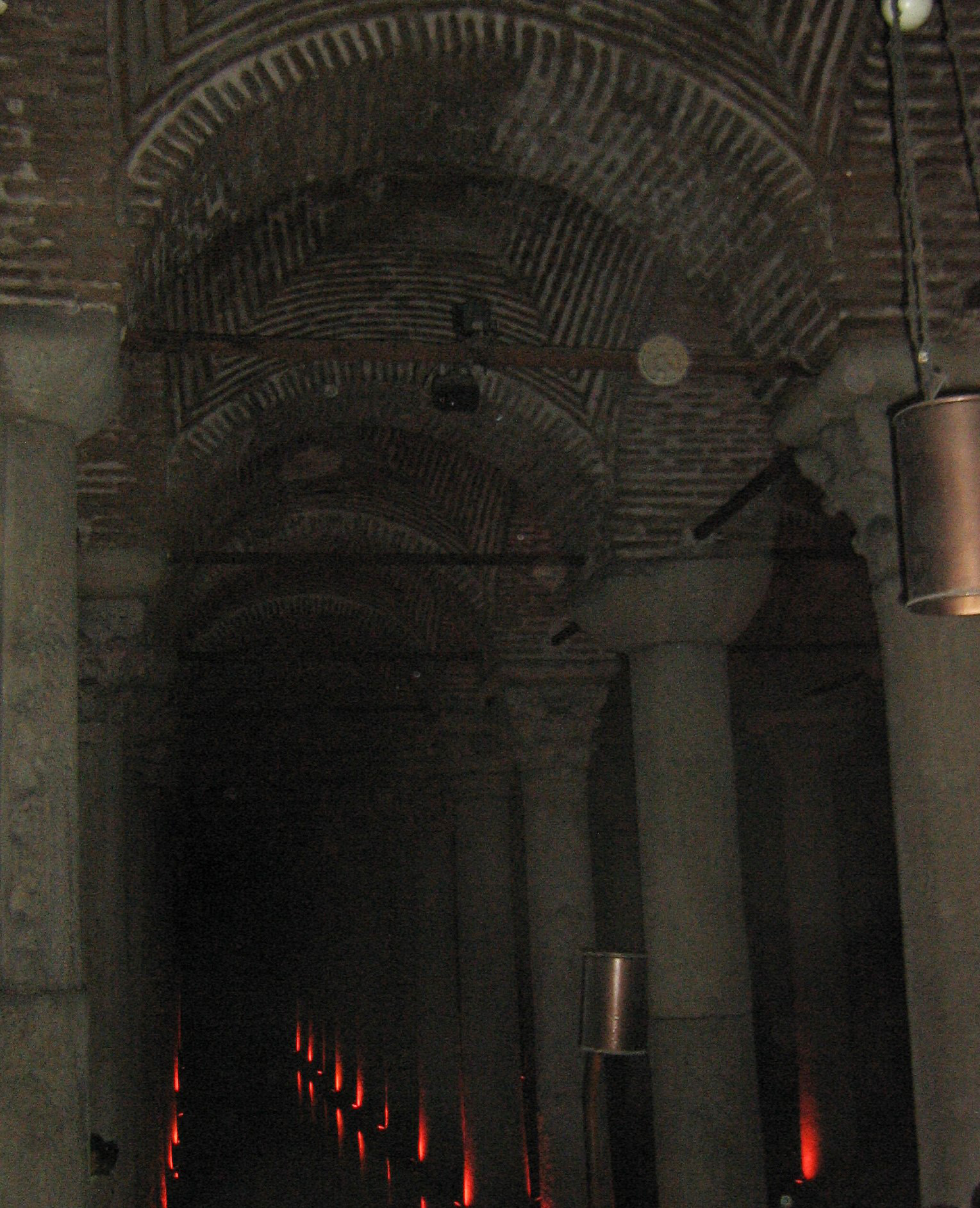 The Basilica Cistern is the largest of several hundred ancient cisterns that lie beneath the city of Istanbul; built in the 6th century A.D., it acquired its name from a great basilica that used to stand over the location. The cathedral-size cistern is an underground chamber approximately 138 m (453 ft) by 65 m (213 ft) capable of holding 80,000 cu m (2,800,000 cu ft) of water. The ceiling is supported by a forest of 336 marble columns, each 9 m (30 ft) high, arranged in 12 rows of 28 columns each spaced 5 m (16 ft) apart. The majority of the columns in the cistern appear to have been recycled from the ruins of older buildings from throughout the Byzantine Empire. They are carved and engraved out of various types of marble and granite.