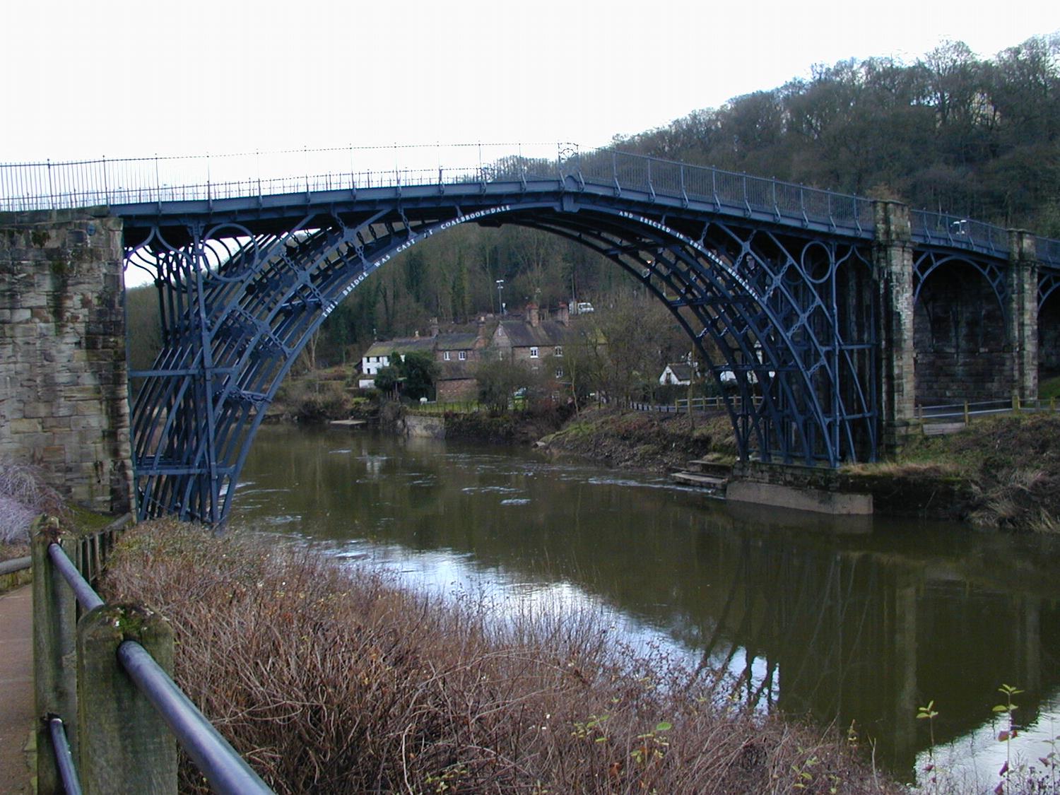 Iron Bridge spans the Severn River near the town of Ironbridge, England; it was the first arch bridge made of cast iron. Constructed in 1779, the bridge opened in 1781; vehicular traffic was barred from it in 1934. 