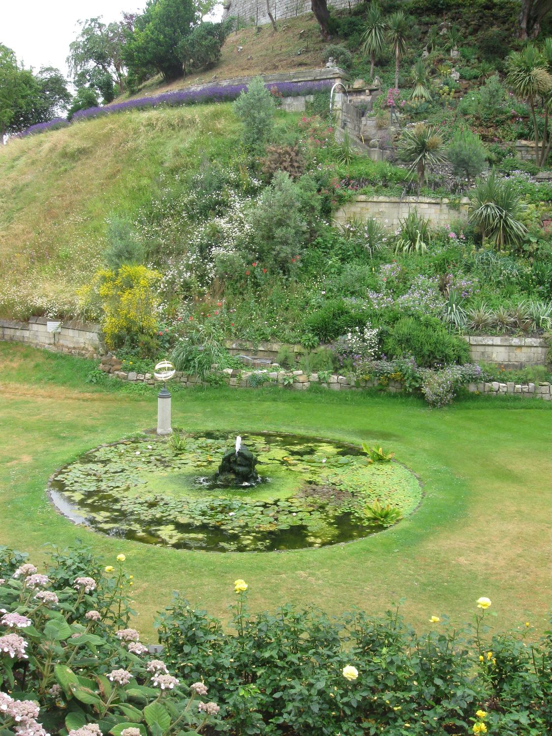 Gardens and pond at Windsor Castle in Berkshire, England.