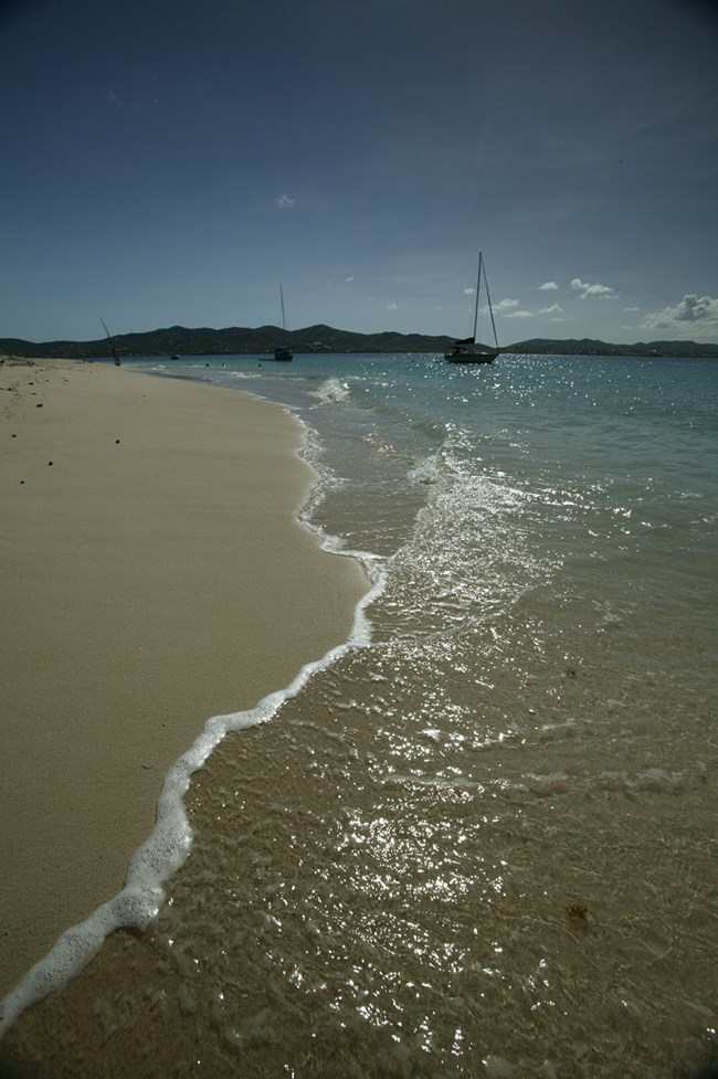 Sparkling receding waters at a Buck Island beach.  Photo courtesy of the US National Park Service/Sean Corsaut.
