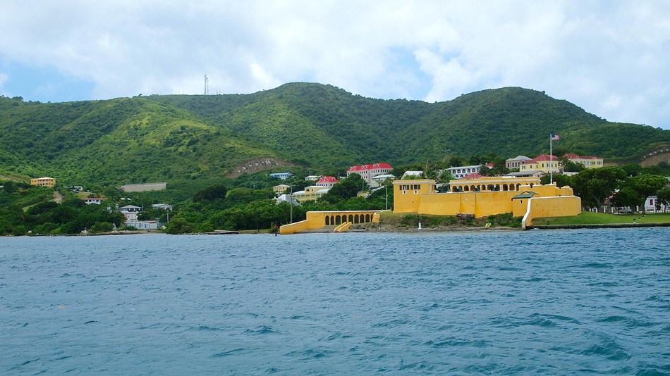 The Christiansted waterfront/wharf area on the island of Saint Croix with the prominent Fort Christiansvaern. Photo courtesy of the US National Park Service.
