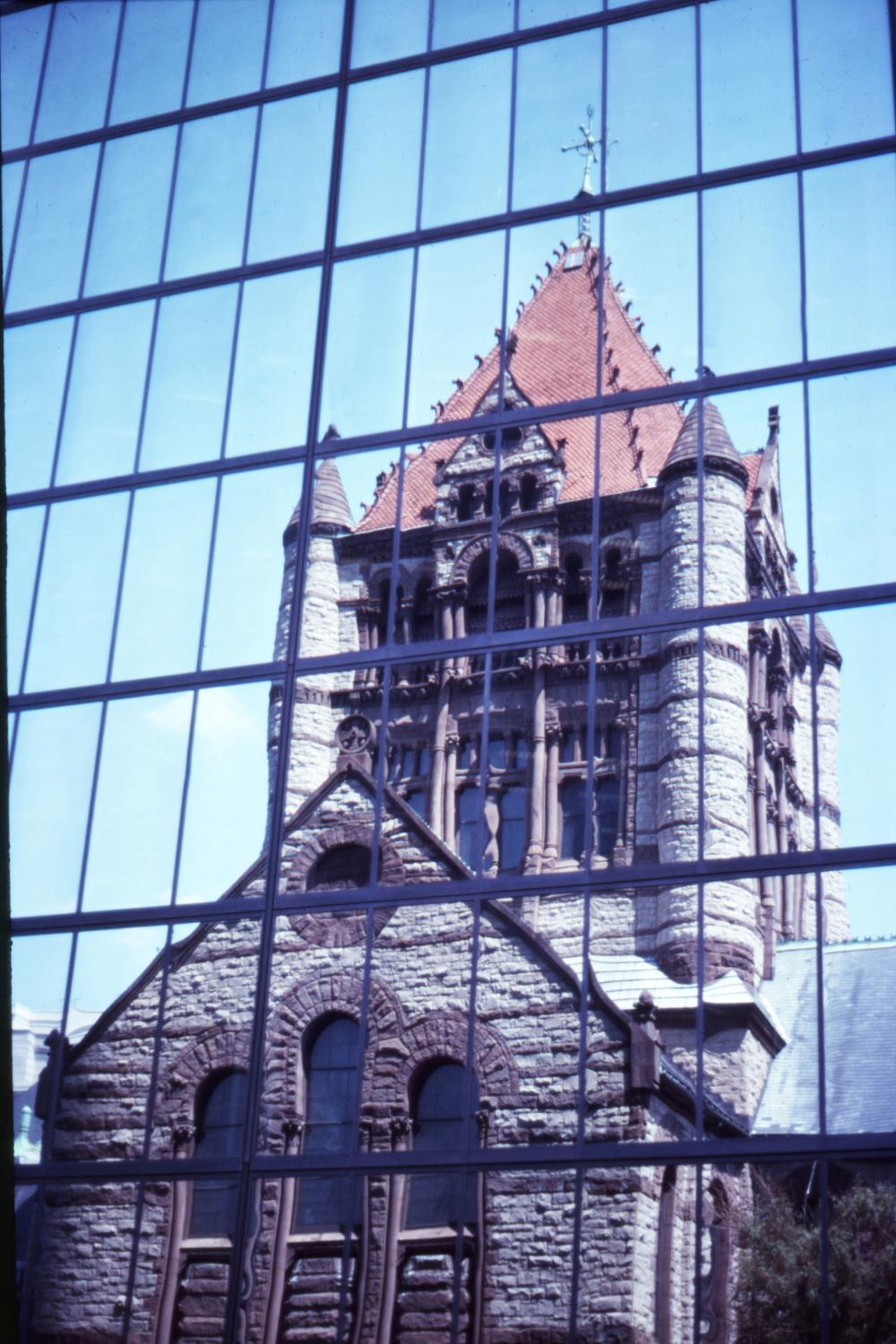 Trinity Church on Copley Square in Boston, Massachusetts lies literally within the shadow of the John Hancock Tower (New England's tallest). The church's reflection within the office building's windows creates an interesting juxtaposition of architectural styles.
