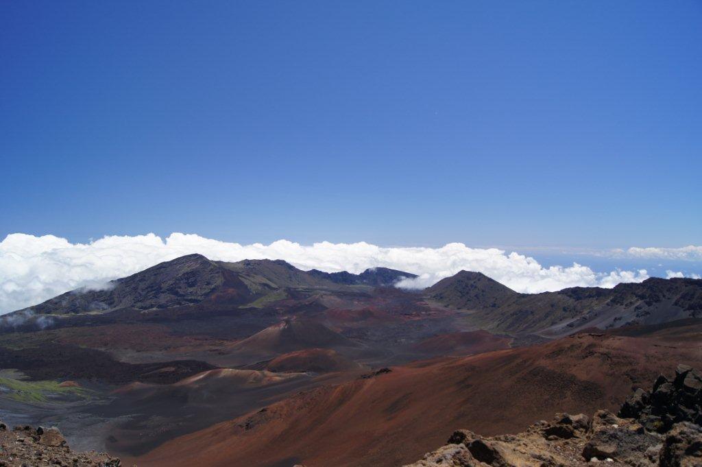 Multicolored cinder cones in Haleakala (House of the Sun) Crater on the island of Maui. The tallest peak on the mountain is 3,055 m (10,023 ft) above sea level, which is frequently high enough to overlook the clouds. 