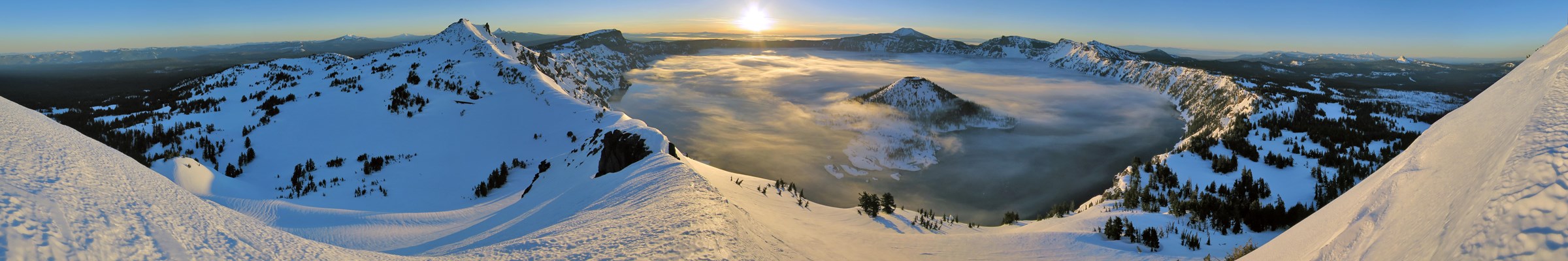 A panoramic  view of Crater Lake, Oregon in winter. Photo courtesy of the US National Park Service.