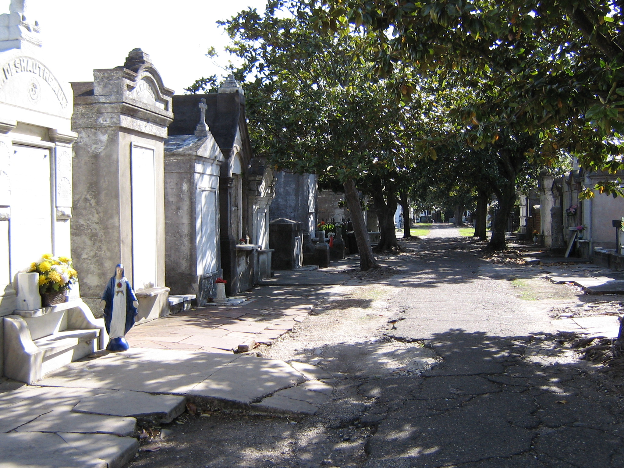 New Orleans is well known for the unique way in which its dead are buried - in above ground cemeteries and mausoleums. Because much of the city is at or below sea level, there is a high water table in the soil. If a body or coffin is placed in an in-ground tomb in New Orleans, there is risk of it being water-logged or even displaced from the ground. For this reason, the people of New Orleans have generally used above-ground tombs. Over the years as designs have evolved, these tombs have become architecturally, culturally, and historically distinct. 