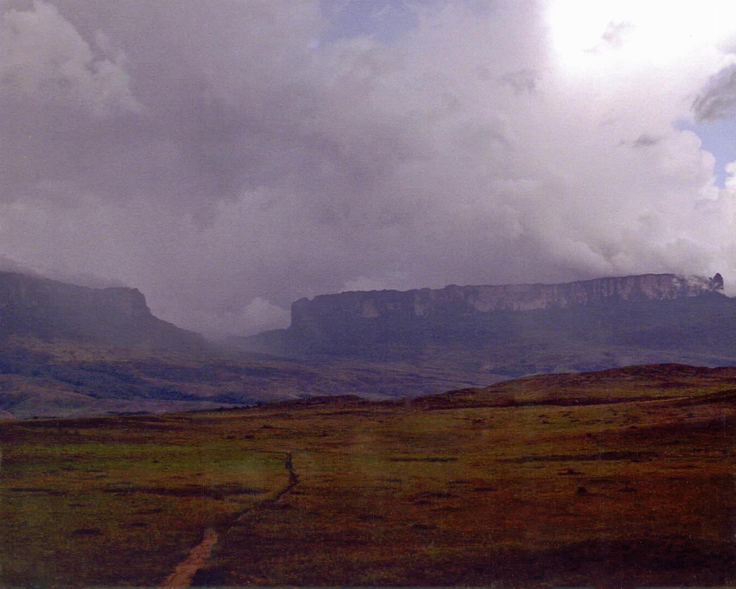 Mount Roraima on the right is the world's highest tepui (tabletop mountain), its peak is 2,835 meters; on the left is Kukeras Tepui.
