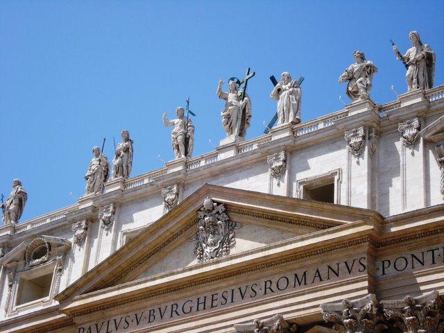 A statue of Christ and some of his apostles on the facade of St. Peter's Basilica. 