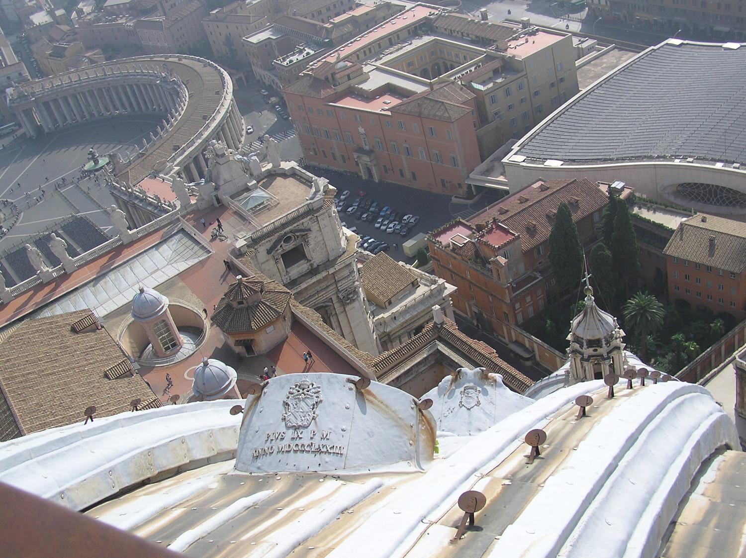 Looking down from the dome of St. Peter's Basilica. St. Peter's Square is in the upper left; the modern Audience Hall in the upper right.