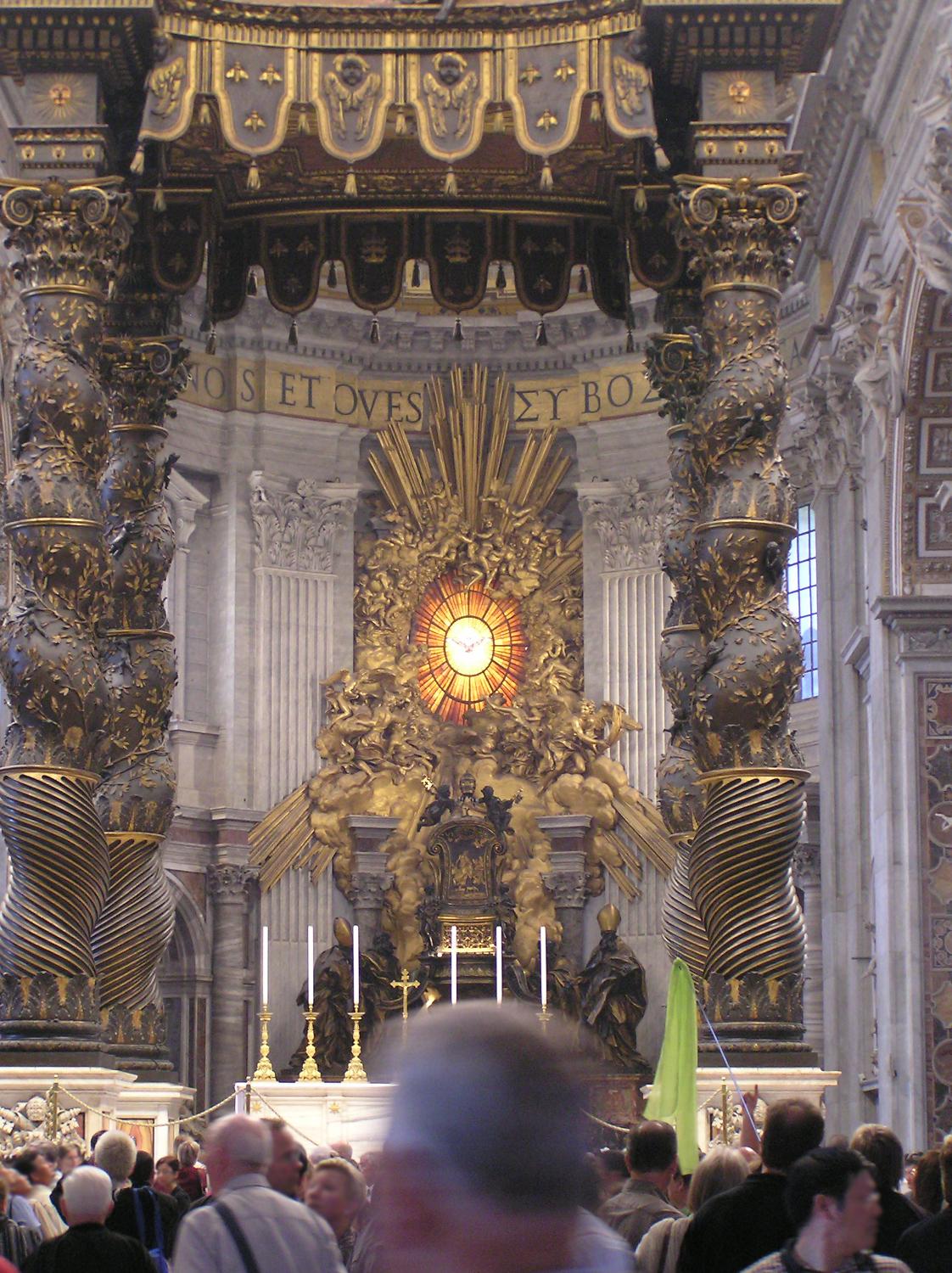 Closer view of the baldachin. Viewed through the structure are the Cathedra Petri (Throne of St. Peter) and the Gloria, a magnificently framed stained glass sculpture, both by Bernini.