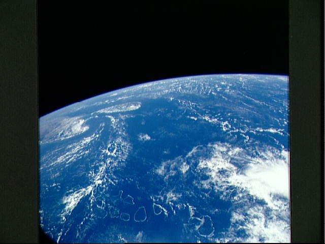 A view over the Indian Ocean as seen from the space shuttle. The bottom portion of the photo shows the complete chain of the atolls that form the Maldive Islands. Off to the left are the southern portion of India, the Palk Strait, and the island of Sri Lanka. Image courtesy of NASA. 