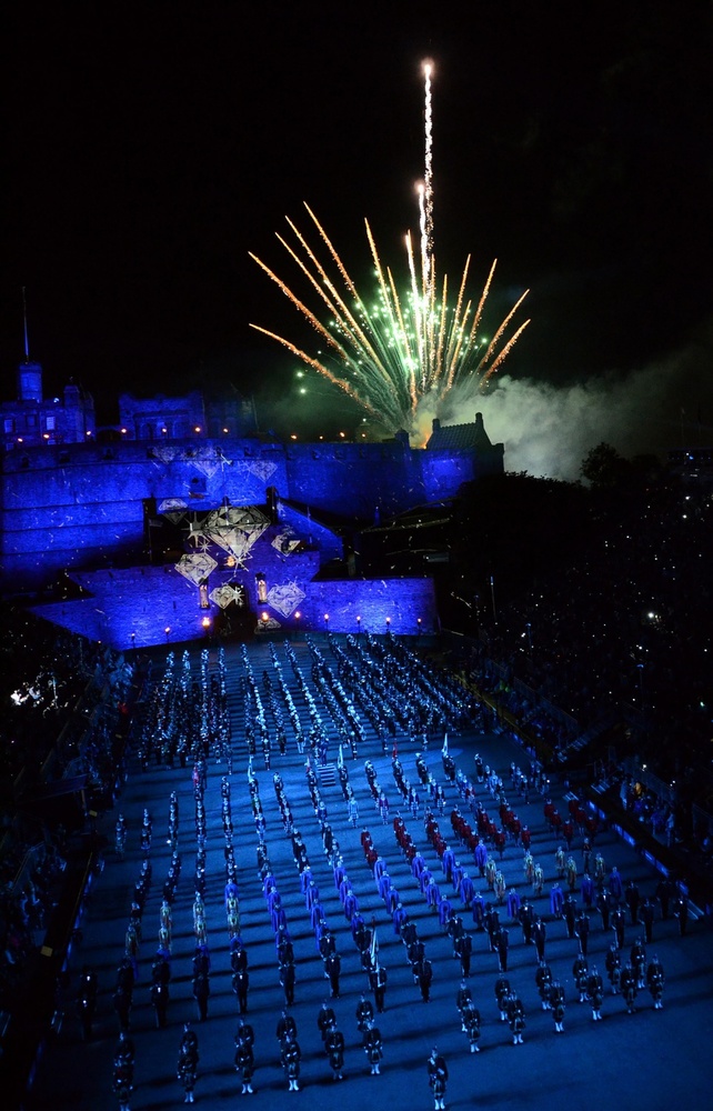 Fireworks shoot off from the castle and diamonds are projected onto the castle walls as multinational musicians and performers play "Diamonds are Forever" in honor of Her Majesty Queen Elizabeth II's Diamond Jubilee year during a Royal Edinburgh Military Tattoo on 2 August 2012. This military tattoo brings together musicians, dancers and bagpipers from around the world to perform in Europe’s most prestigious military tattoo and this year marks the first time since 1950 that a US Navy band has performed in the show. Photo courtesy of the US Navy/ Petty Officer 2nd Class Patrick Grieco.