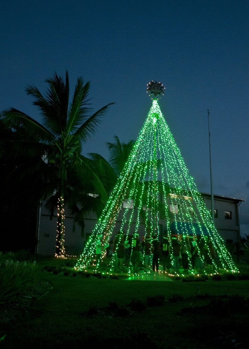 Personnel from the US Navy Support Facility Diego Garcia kick off the holiday season with a Christmas tree lighting in front of the administration building. Photo courtesy of the US Navy/ Mass Communication Specialist Seaman Alex Smedegard.