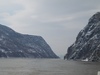 The Iron Gates is a gorge on the Danube River; it forms part of the boundary between Serbia and Romania. In the broad sense, it encompasses a route of 134 km (83 mi); in the narrow sense, it only includes the last barriers on this route - two hydroelectric dams and two power stations just beyond the city of Orsova. 