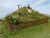 Another view of a replica Norse sod longhouse, north of the archaeological site at L’Anse Aux Meadows.