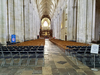 The nave of Winchester Cathedral in Hampshire, England. Construction began in 1079 and the church was consecrated in 1093; additions to the structure took place in subsequent centuries. Winchester Cathedral is one of the largest in Europe and has the greatest overall length (169 m) of any Gothic cathedral.