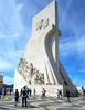 The Padrao dos descobrimentos (Monument to the Discoveries) in Lisbon honors monarchs, explorers, navigators, cartographers, scientists, and missionaries from the Age of Discovery (15th and 16th centuries). The main statue of Henry the Navigator (1394-1460), holding a model of a carrack, leads a procession of 32 figures (16 on either side ramp) on the monument. This view is of the east side.