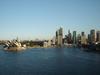 View of Sydney's Harbor and skyline, including the famous Opera House.
