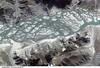 The Brahmaputra River carves a narrow west-east valley between the Tibetan Plateau to the north and the Himalaya Mountains to the south, as it rushes eastward for more than 1,500 km (940 mi) in southwestern China. This 15-km (9-mi) stretch is situated about 35 km (22 mi) south of the ancient Tibetan capital of Lhasa where the river flow becomes intricately braided as it works and reworks its way through extensive deposits of erosional material. Click on photo for higher resolution. Image courtesy of NASA.
