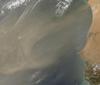 A dust storm off the west coast of Africa sprawls towards the Cape Verde Islands. Six of the ten main islands can be discerned on this image. Click on photo to increase resolution. Image courtesy of NASA. 