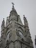 One of the front towers of the Basilica del Voto Nacional (Basilica of the National Vow), a Roman Catholic church in the historic center of Quito. Begun in the late 19th century, it was consecrated in 1988. Technically the basilica remains unfinished, since, according to local legend, its completion would signal the end of the world. 