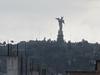 The Virgin of the Apocalypse statue overlooking historic Quito from El Panecillo hill. 