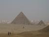 The Pyramid of Menkaure is the smallest of the three kings' pyramids on the Giza Plateau. The city of Cairo appears in the background.
