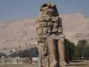 One of a pair of 30-meter (50-ft) statues of Amenhotep III that once stood before the pharaoh's mortuary temple in the Theban Necropolis on the west bank of the Nile opposite Luxor. The rest of the temple was dismantled, and the materials used for other construction projects. The statues were called the "Colossi of Memnom" by Egypt&amp;apos;s late Ptolemaic (Greek) rulers who associated them with the myth of Memnon.