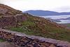 View along the "Ring of Kerry" drive, Iveragh Peninsula, County Kerry. The Ring is a 179 km (111 mi) tourist trail in southwestern Ireland that starts and ends in Killarney. Because the narrow roads make it difficult for tour busses to pass, all tour coaches travel in a counter clockwise direction. There is also a shorter bike/foot path. 