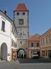 The Prague Gate in the town square of Melnik dates from 1500 when the portal was part of an old medieval fortress. Today its lower floor is a café. 
