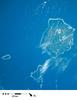 Pohnpei (on the right) is the largest, highest, most populous, and most developed single island in the Federated States of Micronesia. The islanders of Pohnpei have a reputation as being the most welcoming of outsiders among residents of the island group. Pohnpei also contains a wealth of biodiversity and is one of the wettest places on earth with annual recorded rainfall exceeding 7.6 m (25 ft) each year in certain mountainous locations. Image courtesy of NASA.

