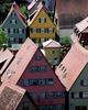 A view of the colorful houses in Dinklesbuehl captured from a church tower. The city is surrounded by medieval walls and towers.