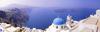 Located  200 km (120 mi) southeast of the mainland, the island of Santorini surrounds a sunken caldera formed by a volcanic explosion that occurred about 1630 B.C. The eruption destroyed and buried Akrotiri, a large Bronze Age Minoan seaport on the island. Excavations begun in 1967 are ongoing.