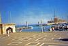 Mandraki Harbor at Rhodes, the site of a third century B.C. statue to the Greek sun god, Helios. Standing some 30 m (100 ft)  high, it became known as the Colossus of Rhodes, and was considered one of the Seven Wonders of the Ancient World.