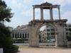 Hadrian's Arch in downtown Athens was built in A.D. 131 or 132 to honor the Roman Emperor Hadrian, possibly for restoring much of the city and completing the nearby Temple of Olympian Zeus. The Parthenon and Acropolis can be seen in the left background. 