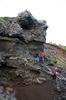 A dike (volcanic feeder tube) merging into layered strata in Thingvellir National Park.  
