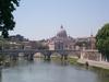 The Vittorio Emanuele Bridge over the Tiber River in Rome with Vatican City in the background. The bridge was completed in 1911. 