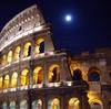 A nighttime view of the Roman Colosseum.