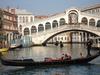 The Rialto Bridge was one of the first bridges to span the Grand Canal in Venice allowing residents to access the Rialto Market. The structure was originally constructed of wood, but after it collapsed twice under the weight of residents watching boat races, it was replaced by a stone bridge in 1591. 