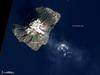 The mild eruptions of Italy's Stromboli volcano are so frequent and numerous that an entire style of volcanism - strombolian - is named after the volcano. Characteristics of strombolian eruptions are nearly continous lava fountaining and emissions of gas, ash, and volcanic bombs. The sight of lava spraying into the night sky has led folks to nickname Stromboli the "Lighthouse of the Mediterranean." This natural-color satellite image shows the island of Stromboli, the volcano's cloud-covered summit (about 924 m; 3,030 ft above sea level), and a thin volcanic plume on 13 January 2011. The current eruption has continued uninterrupted since 1932. Image courtesy of NASA.