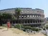 The Colosseum in Rome was first used in A.D. 80.  In Roman times, it was called the Flavian Amphitheater and held 50,000 spectators. The name "Colosseum" was introduce in medieval times and referred to a giant statue of Nero that stood nearby.  The outer walls have three levels of arches with columns topped by Ionic capitals at the lower level and Doric and Corinthian at the top. The 80 entrance/exit arches, known as vomitoria, allowed spectators easy access and the ability to clear the building in minutes.