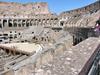 The Roman Colosseum's arena was a wooden floor covered with sand, underlain with rooms and passageways for performers, sets, and animals. Spectator seating was divided into three sections: ordinary people sat in the upper level, the better off in the middle sections, and the elite in the lower level. 