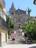 Steps leading to the Church of the Holy Trinity and to the Convento Agostiniano (Augustinian Convent) in Forza d'Agro in Sicily. The arch is named the Porta Durazzo.
