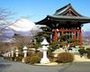 The temple gable mimics the shape of Mt. Fuji in the background. 